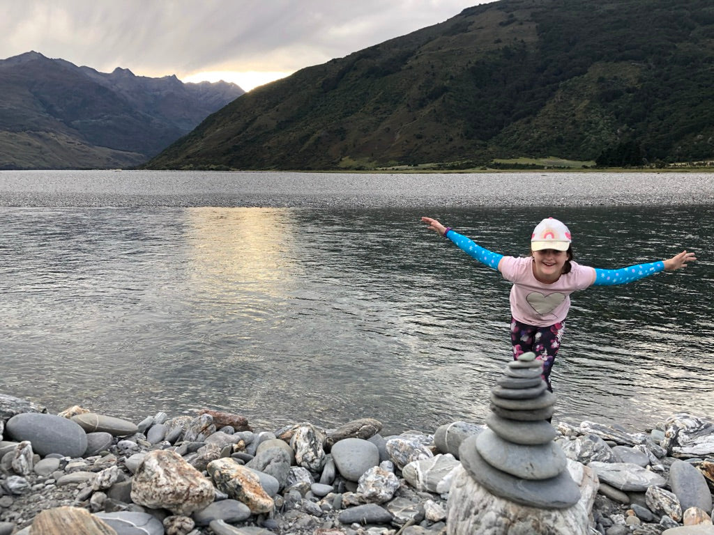 Girl at lake in Crazy arms sun sleeves