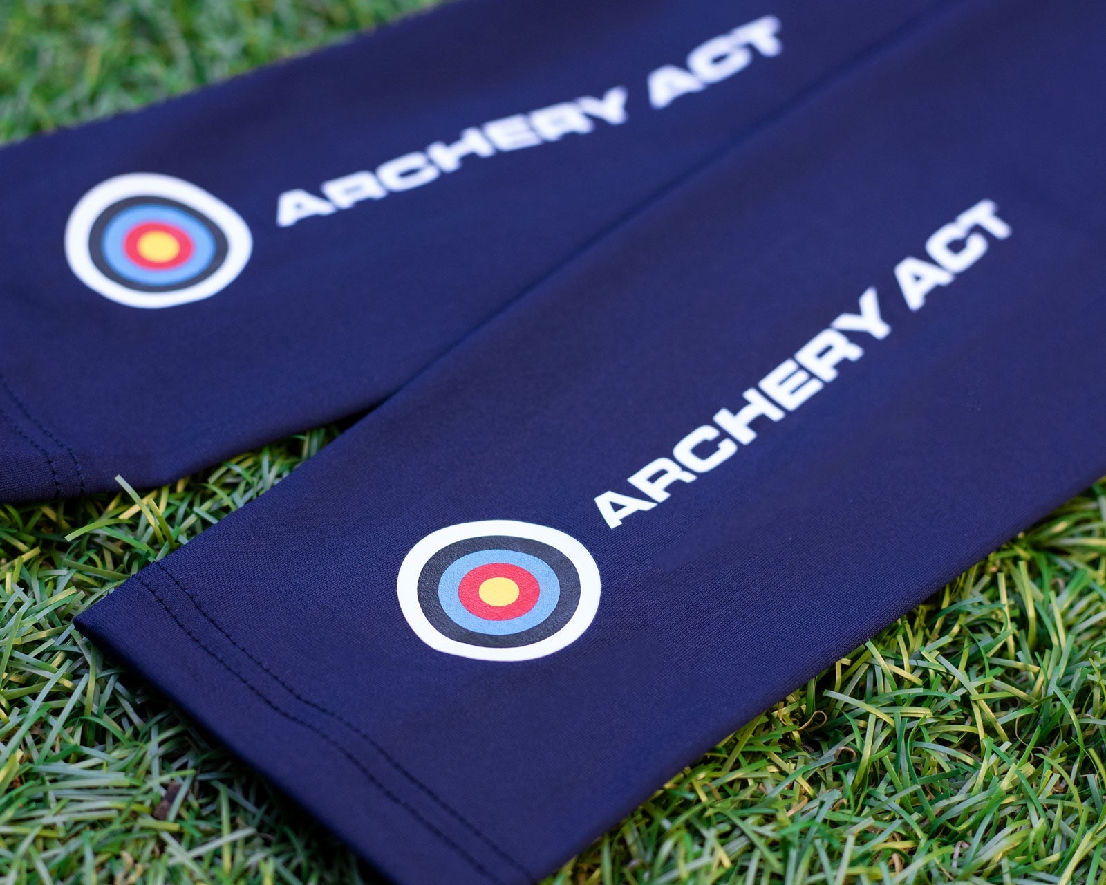 Drak Blue sleeves with archery club logo on