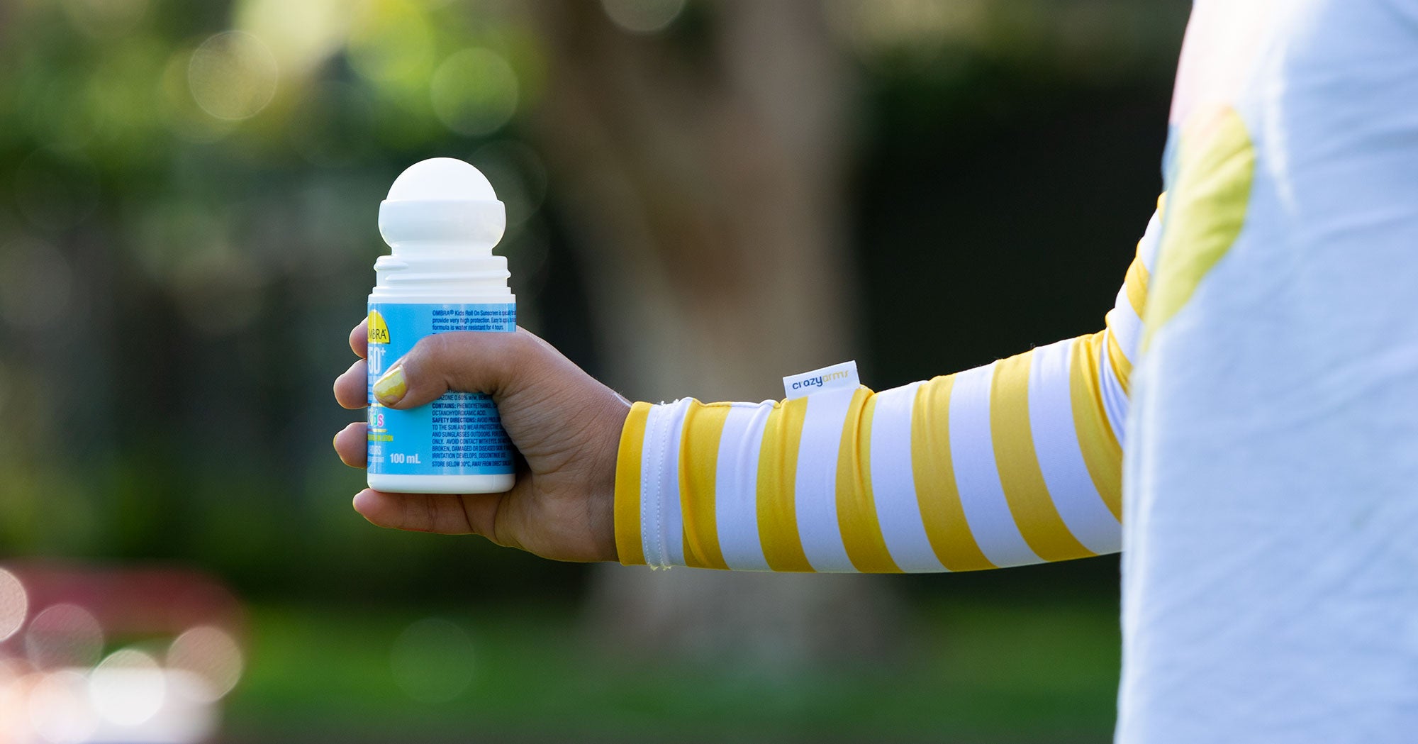 yellow stripe crazy arms holding sunscreen
