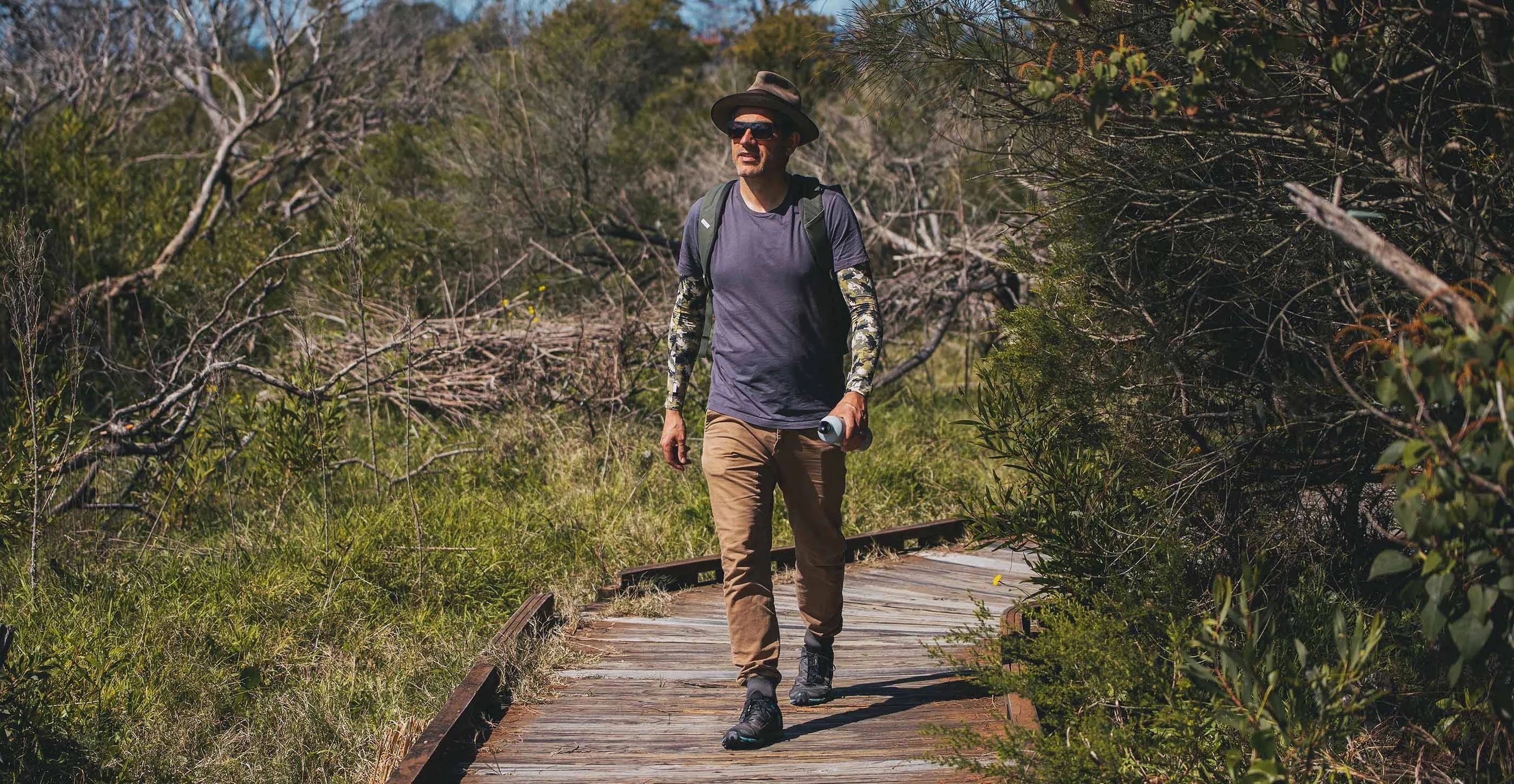 A man out bushwalking wearing Camo Crazy Arms sun sleeves